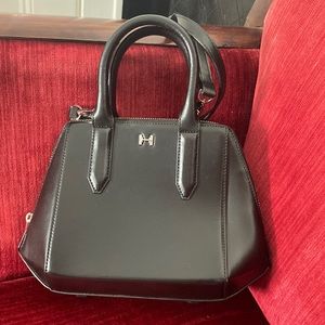 Halston on black leather bag, crossbody or handle held.